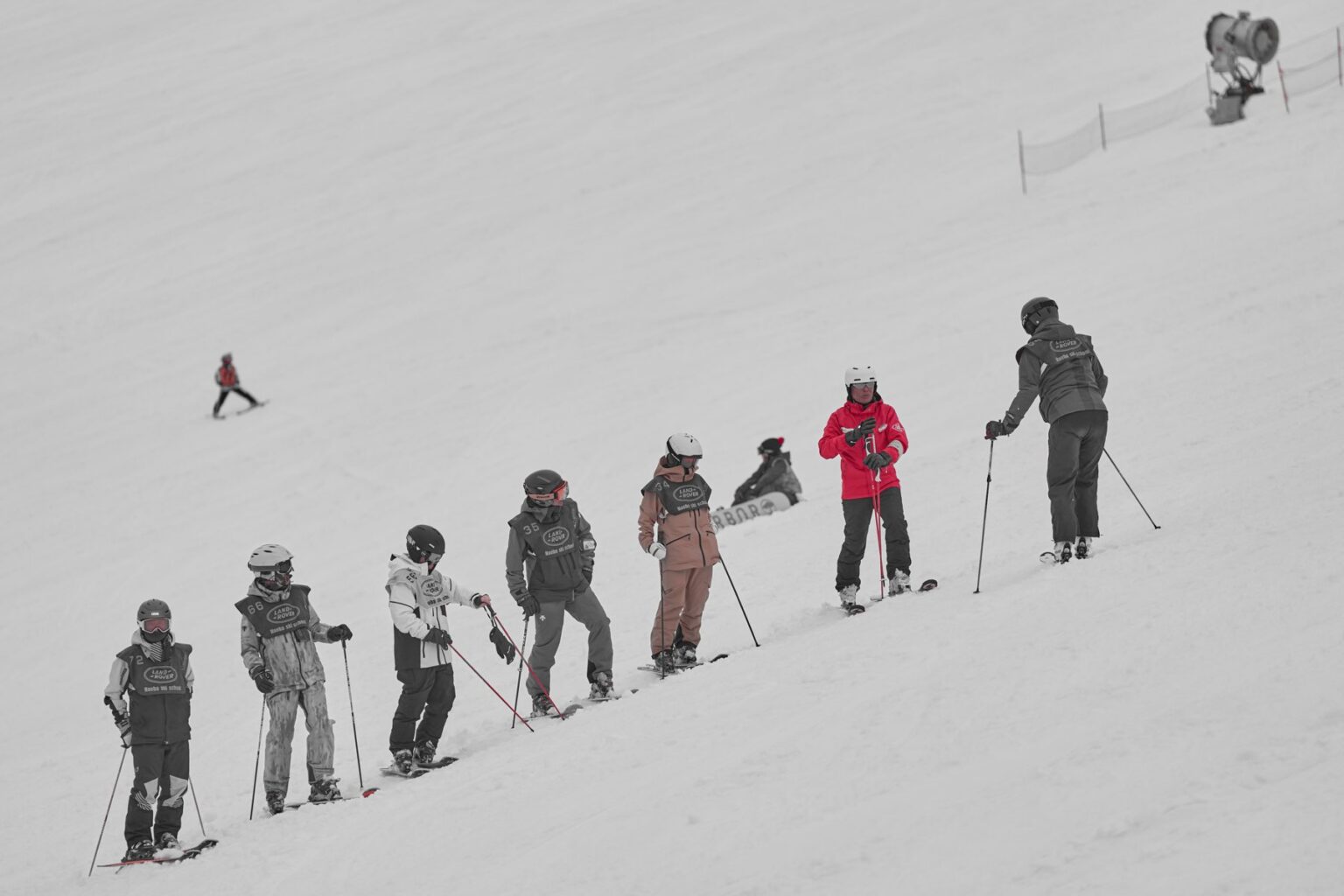 Coach Arai (red jacket) teaching test candidates on the slope